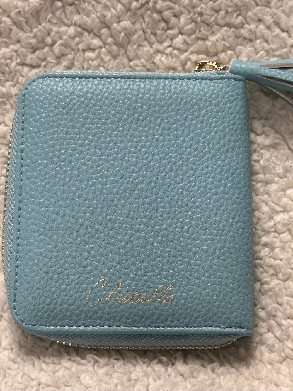 cleobella super cut turquoise  zip wallet, gold trim, tassel,cutouts design NWOT